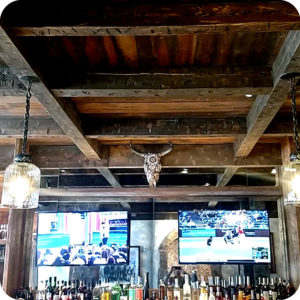 Old Wood Flooring, Architectural Design Elements, Rusic Beams in a bar ceiling.
